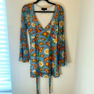 Delia’s Babydoll dress Tie waist butterfly and flower print size medium y2k​